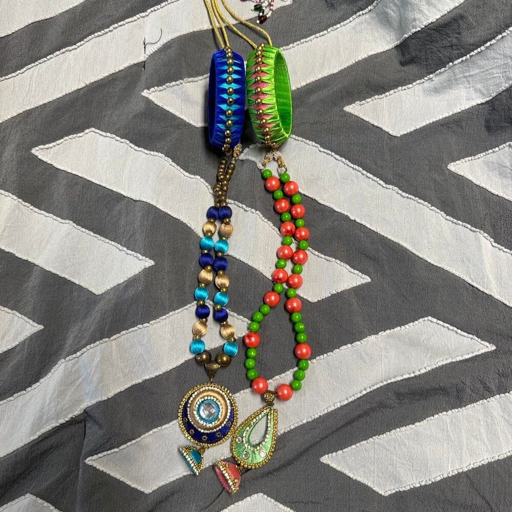 desi beaded necklaces with blue, green, and coral beads and ornate pendants
